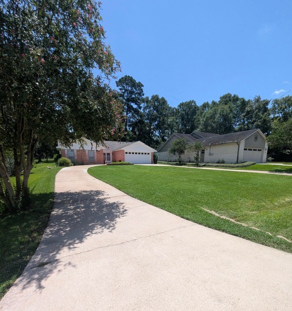 Beautiful home with clean lawn maintained by Good Grounds Services